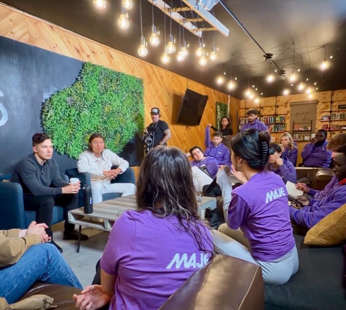 A fireside chat with the Maje team in purple shirts