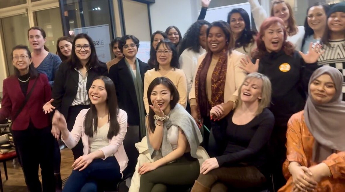 A cheerful group photo at a women's workshop